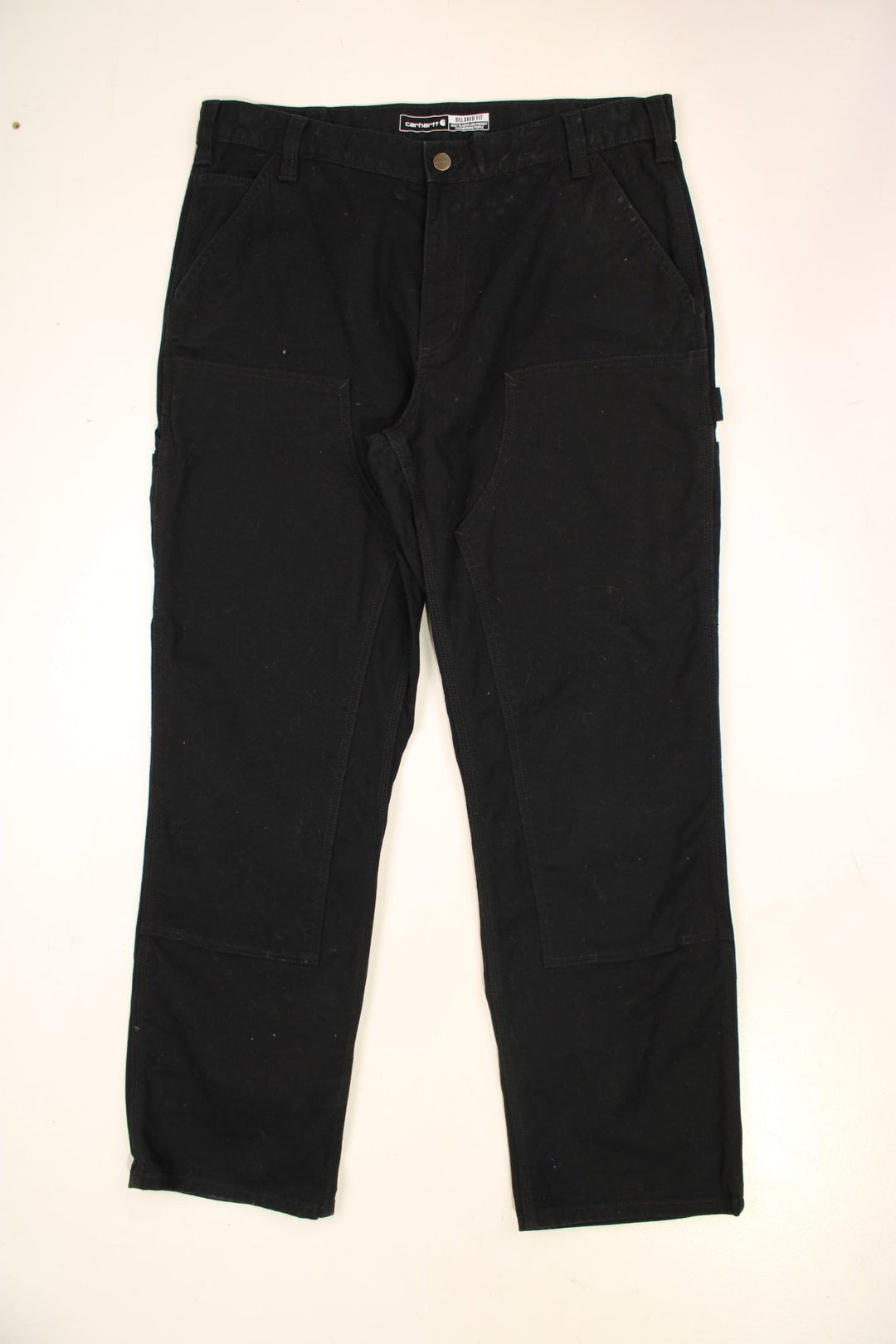 Carhartt Double Knee Jeans in a black colourway with multiple pockets and the logo embroidered on the back.