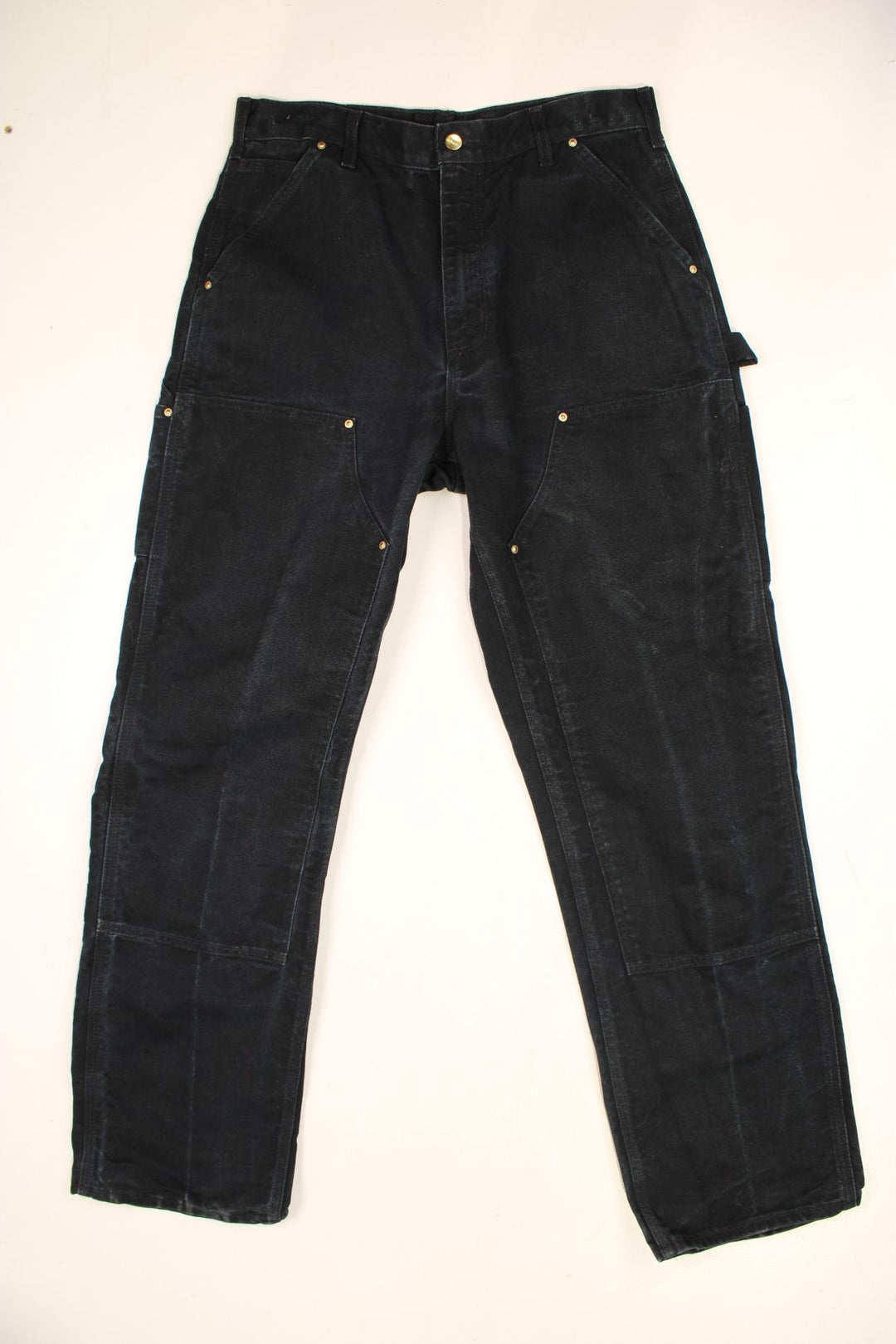 Carhartt Double Knee Jeans in a black colourway with multiple pockets and the logo embroidered on the back.