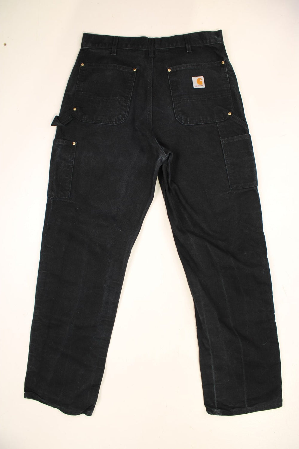 Carhartt Double Knee Jeans in a black colourway with multiple pockets and the logo embroidered on the back.