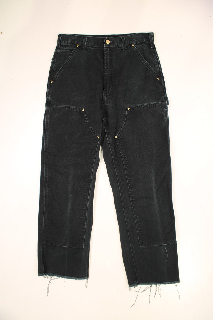 Carhartt Double Knee Jeans in a black colourway with multiple pockets and the logo embroidered on the back.