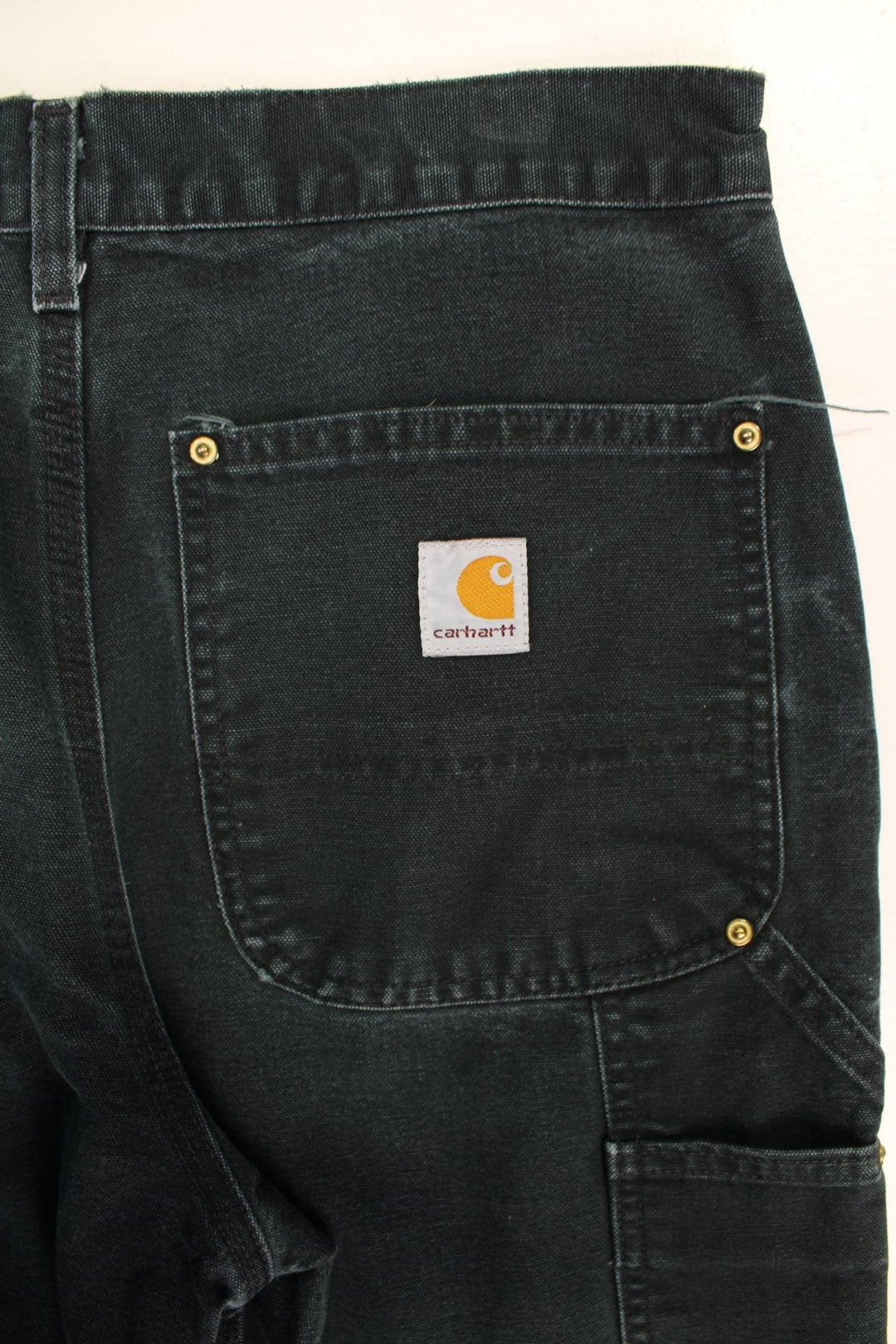 Carhartt Double Knee Jeans in a black colourway with multiple pockets and the logo embroidered on the back.