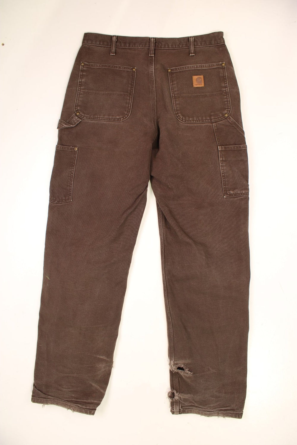 Carhartt Double Knee Jeans in a brown colourway with multiple pockets and the logo embroidered on the back.