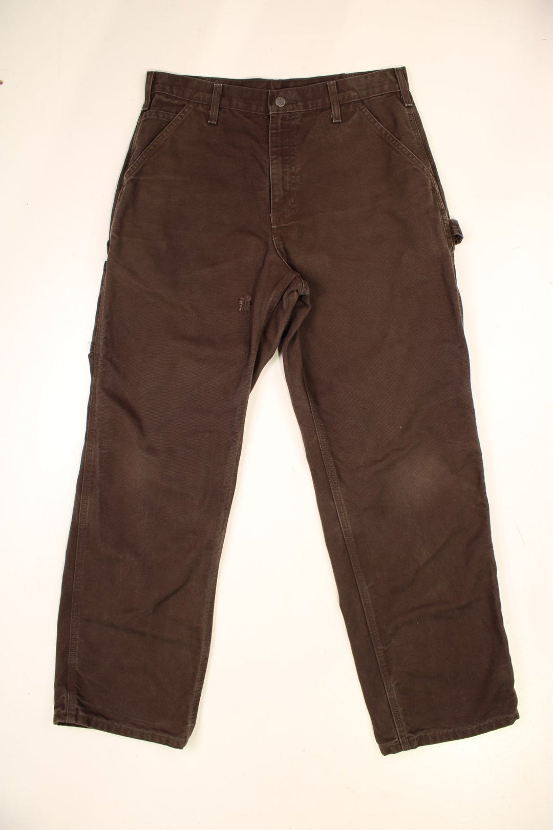 Carhartt Carpenter Jeans in a brown colourway with multiple pockets and the logo embroidered on the back.