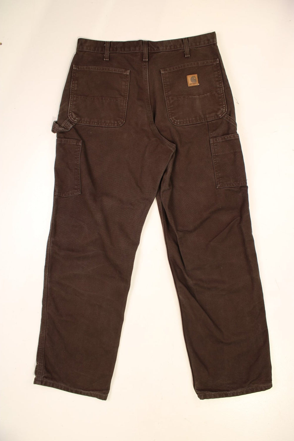 Carhartt Carpenter Jeans in a brown colourway with multiple pockets and the logo embroidered on the back.