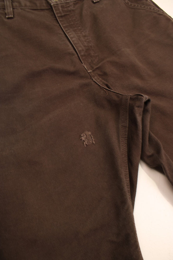 Carhartt Carpenter Jeans in a brown colourway with multiple pockets and the logo embroidered on the back.