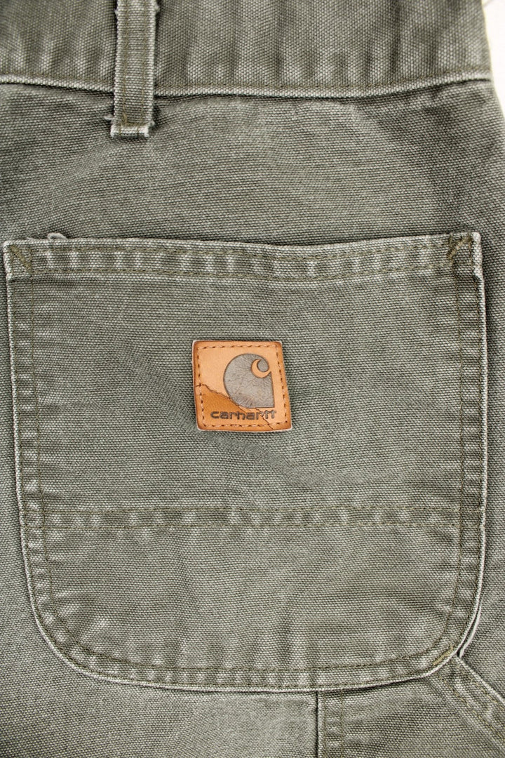 Carhartt Carpenter Jeans in a khaki green colourway, has multiple pockets and the logo embroidered on the back. 