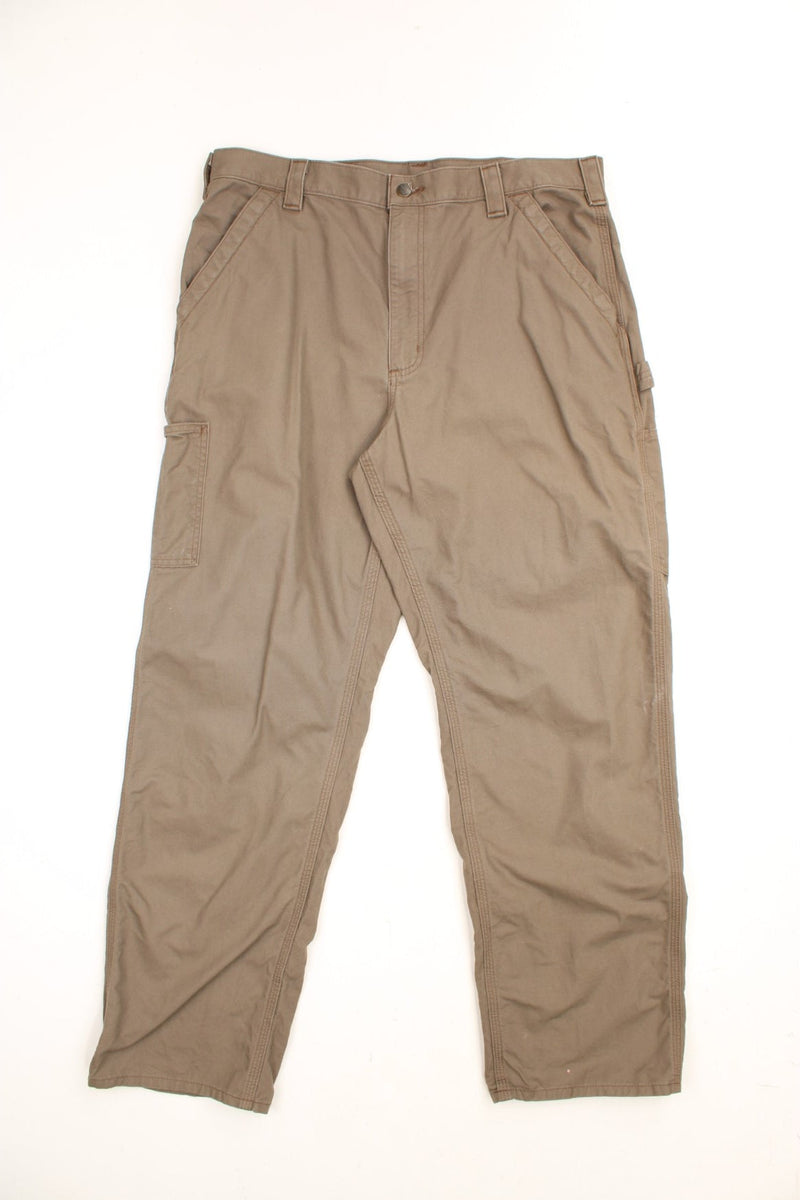 Carhartt Carpenter Trousers in a brown colourway, loose fit, has multiple pockets and the logo embroidered on the back.