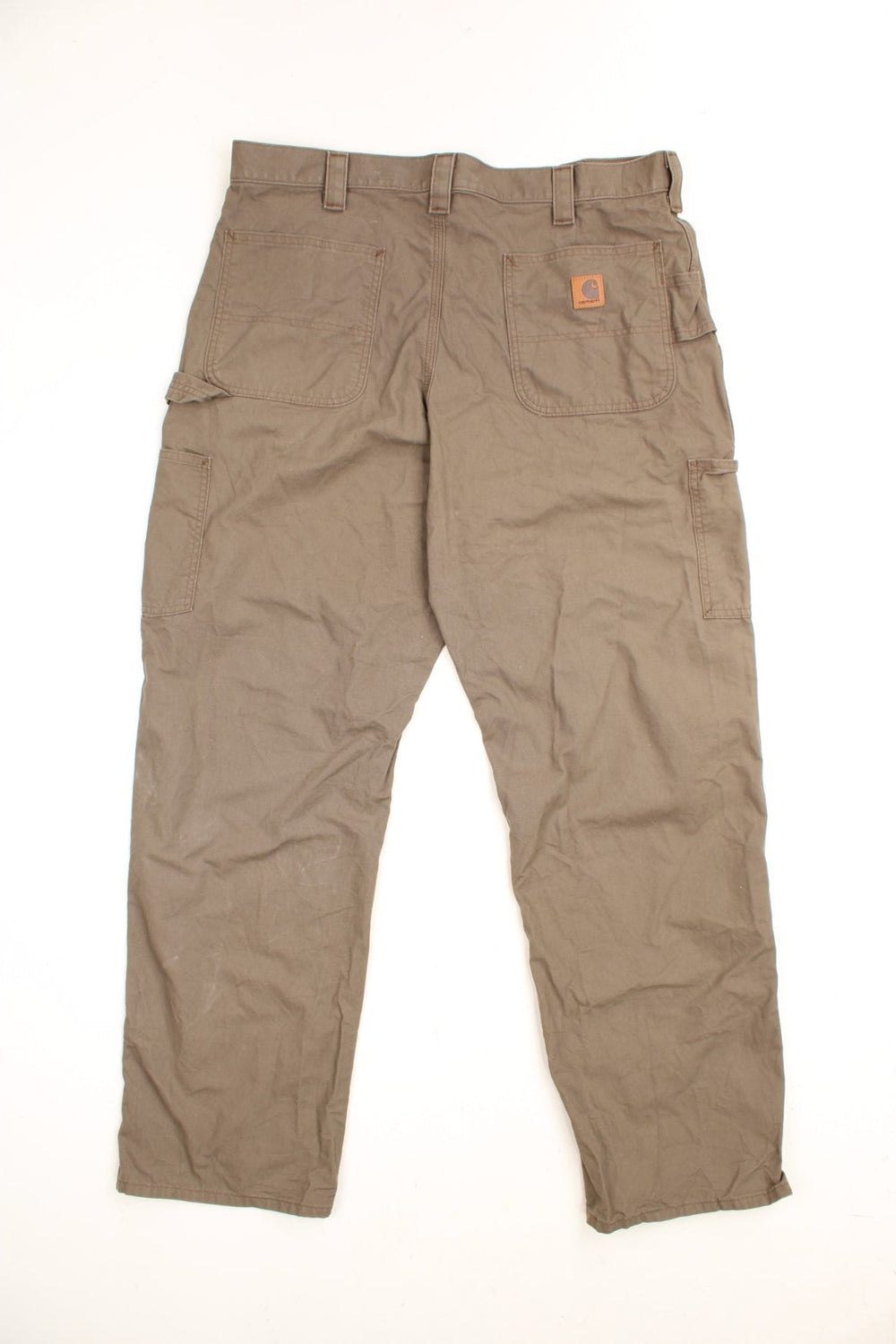 Carhartt Carpenter Trousers in a brown colourway, loose fit, has multiple pockets and the logo embroidered on the back.