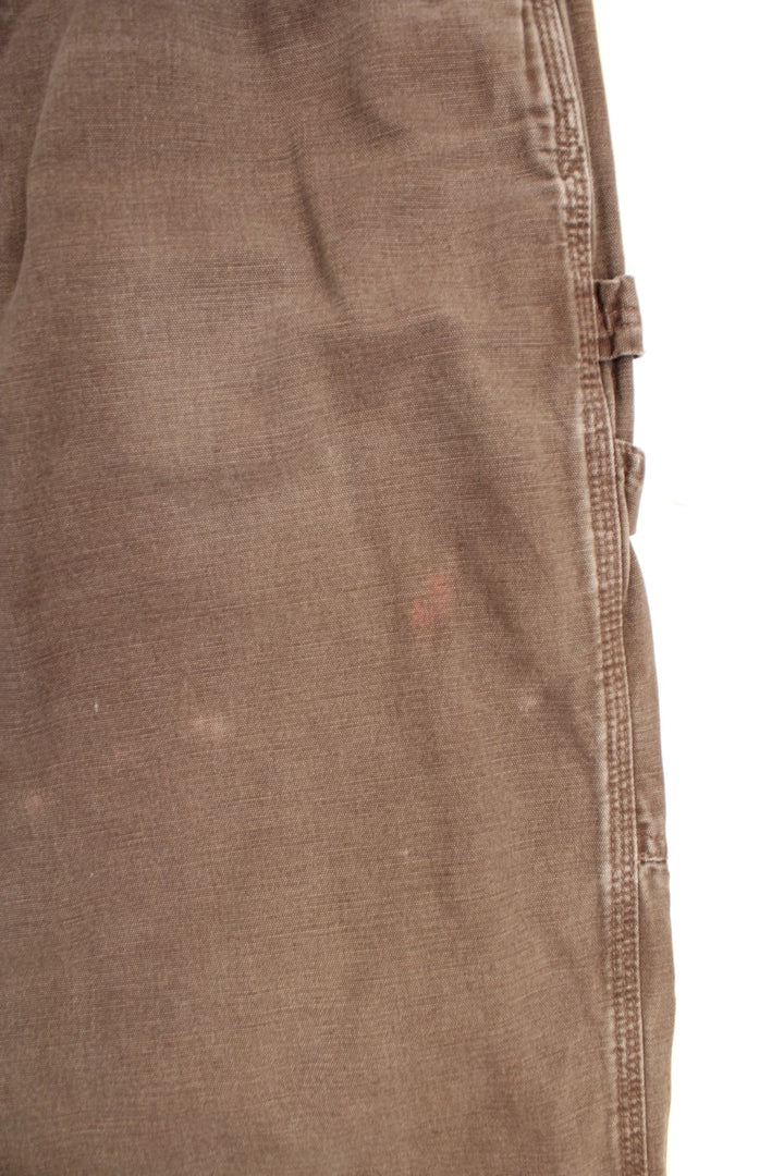 Carhartt Carpenter Jeans in a faded brown colourway, has multiple pockets and the logo embroidered on the back. 