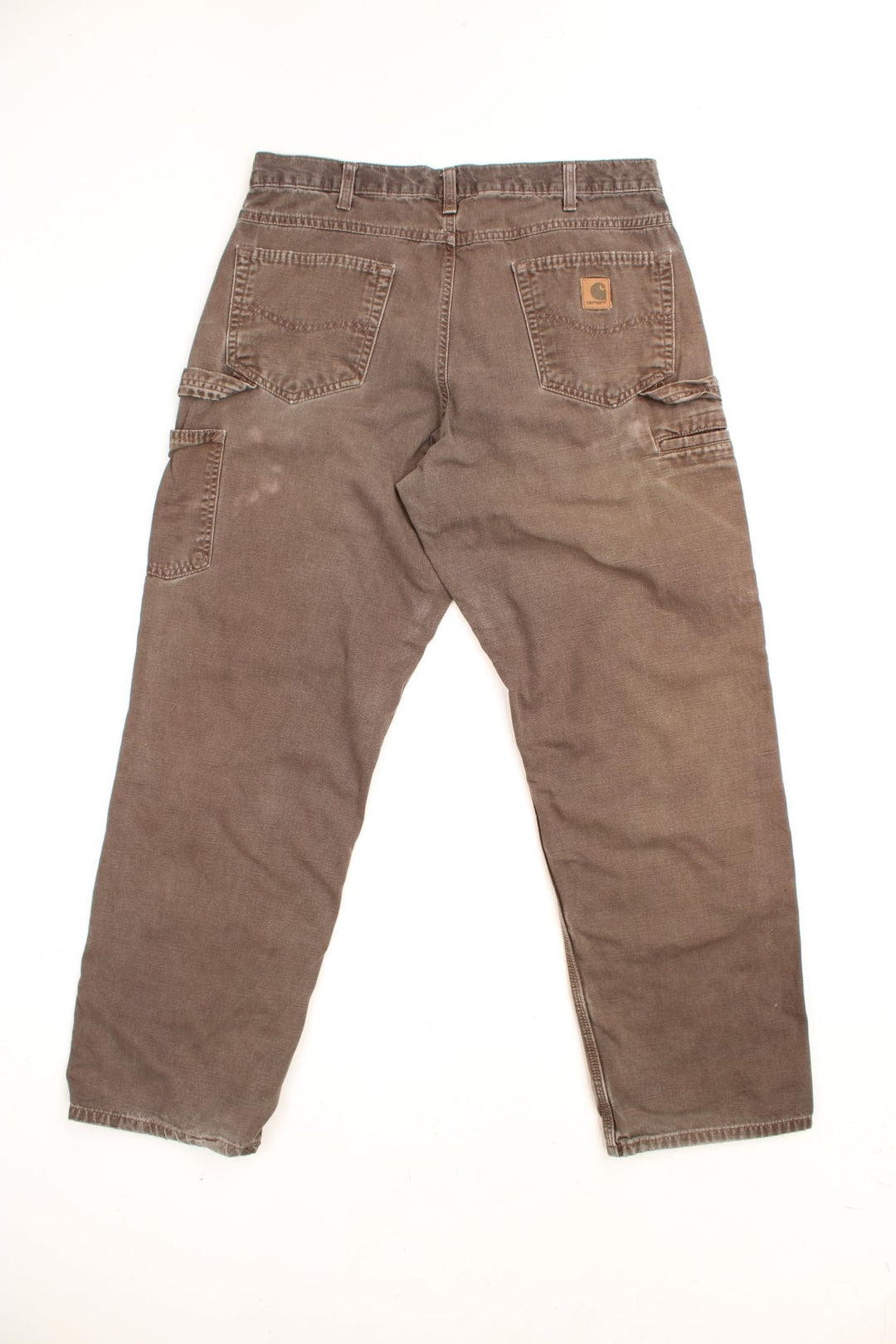 Carhartt Carpenter Jeans in a faded brown colourway, has multiple pockets and the logo embroidered on the back. 