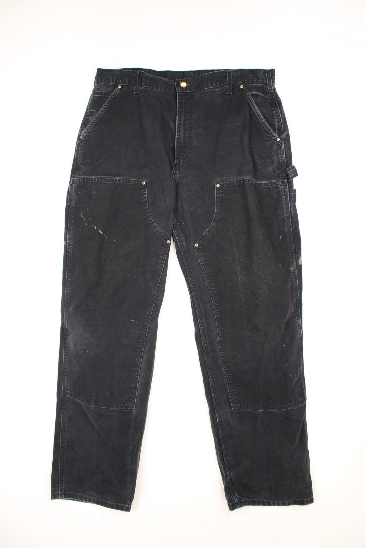 Carhartt double knee jeans with front, back and side pockets, a hammer loop, and a logo patch on the back pocket. 