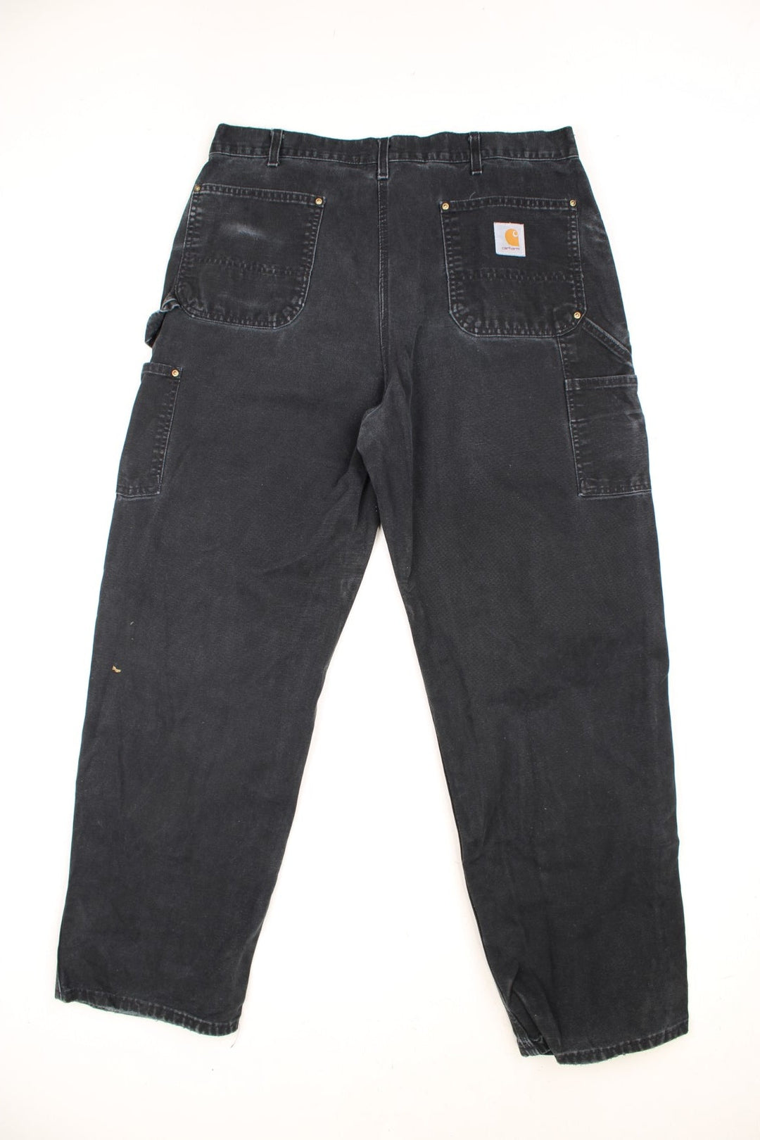 Carhartt double knee jeans with front, back and side pockets, a hammer loop, and a logo patch on the back pocket. 