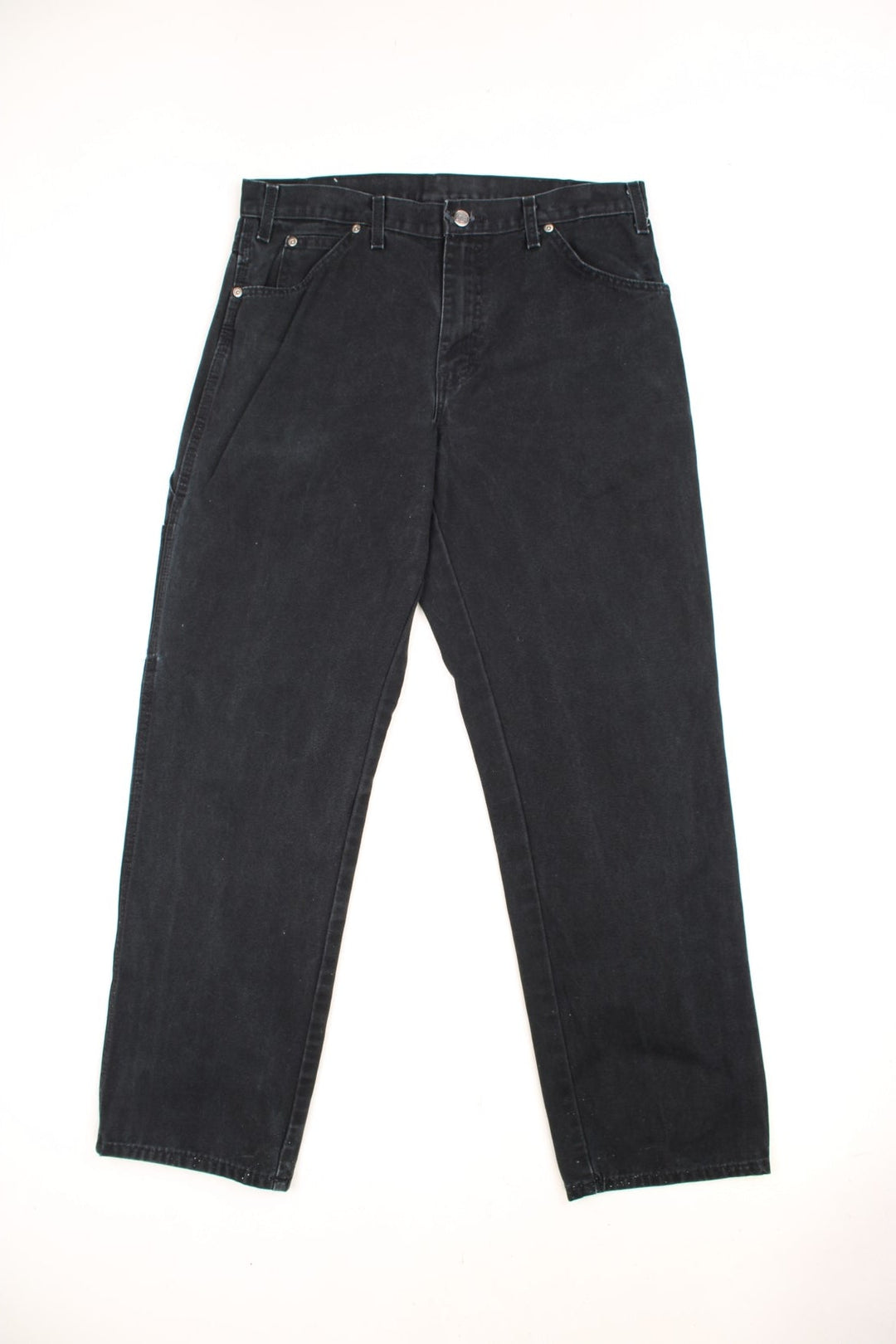 Dickies black carpenter jeans with front, back and side pockets, a hammer loop, and a logo patch on the back pocket. 