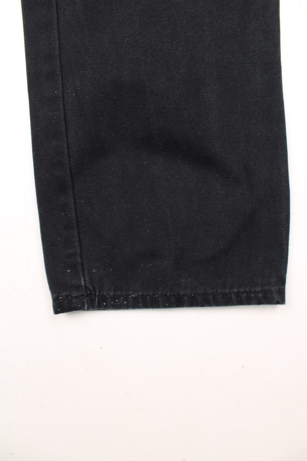 Dickies black carpenter jeans with front, back and side pockets, a hammer loop, and a logo patch on the back pocket. 