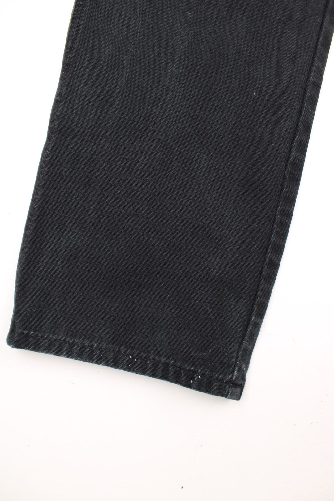 Dickies black carpenter jeans with front, back and side pockets, a hammer loop, and a logo patch on the back pocket. 