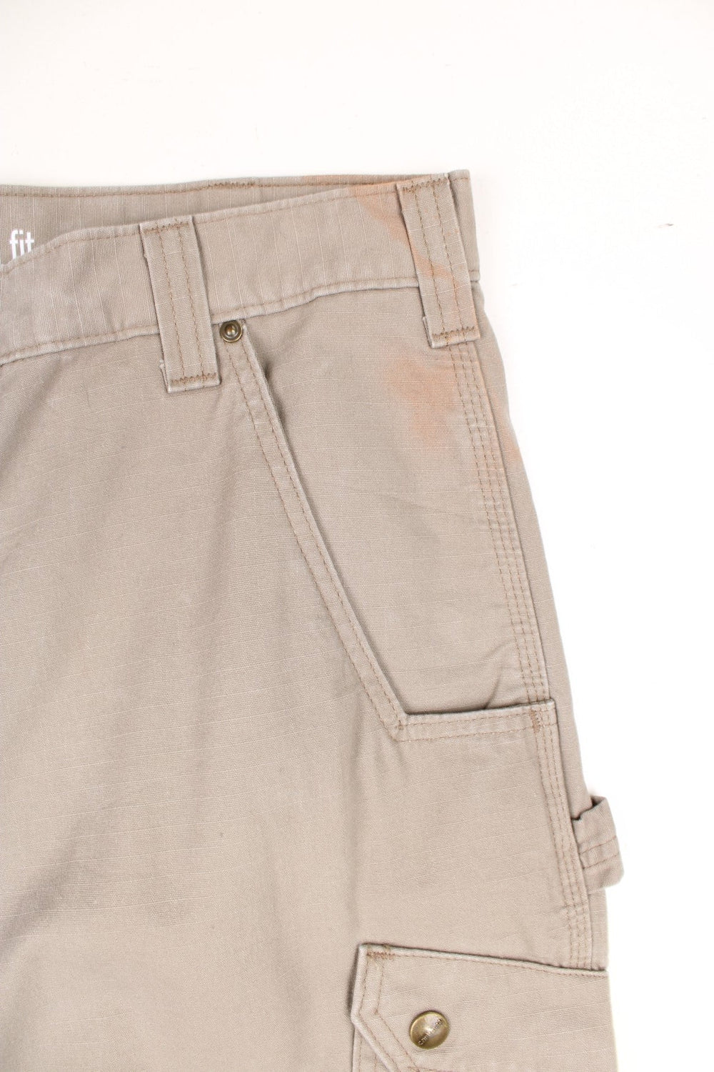 Carhartt tan double knee trousers with a hammer loop, front, back and side pockets and a logo patch on the back pocket. 