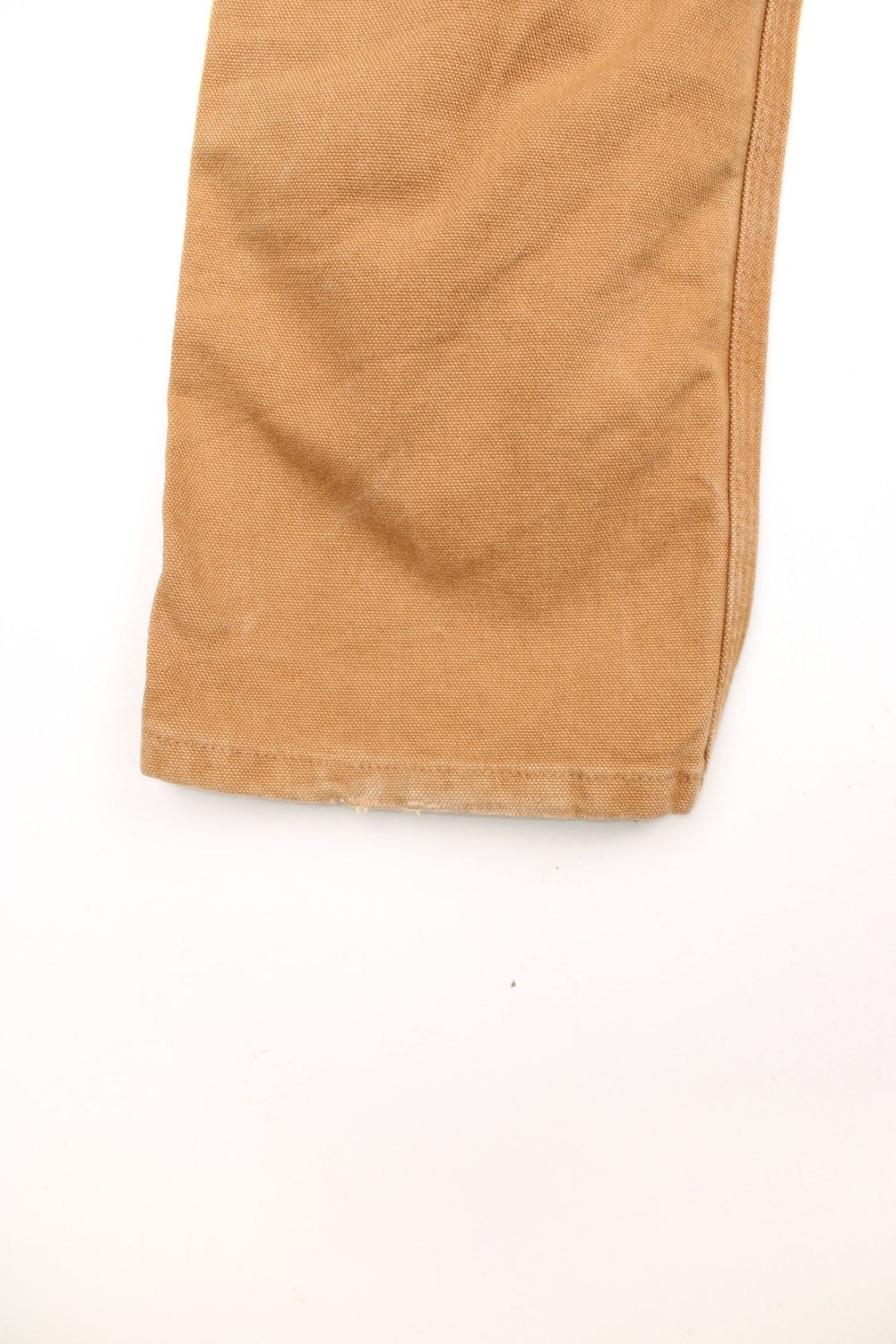 Carhartt tan carpenter jeans with a hammer loop, front, back and side pockets and a logo patch on the back pocket. 