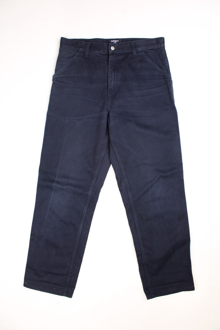 Carhartt WIP Carpenter Jeans in a blue colourway, has multiple pockets and the logo embroidered on the back.