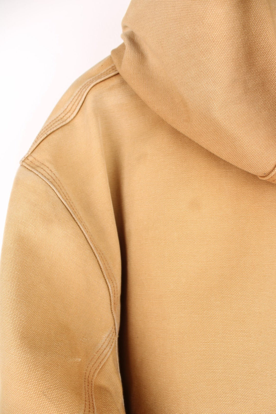 Carhartt Active jacket in tan with zip closure, brown trim and cuffs, an adjustable hood, double side pockets and a logo patch on the lower left. 