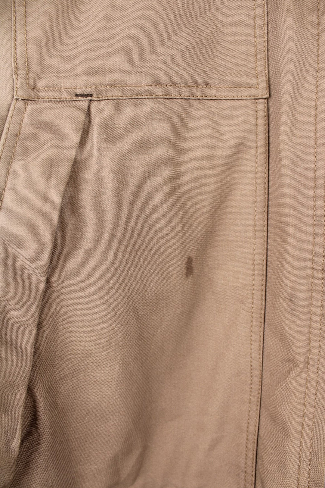 Carhartt work jacket in tan with four pockets, zip closure, a Carhartt logo patch on the upper left and a 'QD Quick Duck' logo on the left sleeve. 