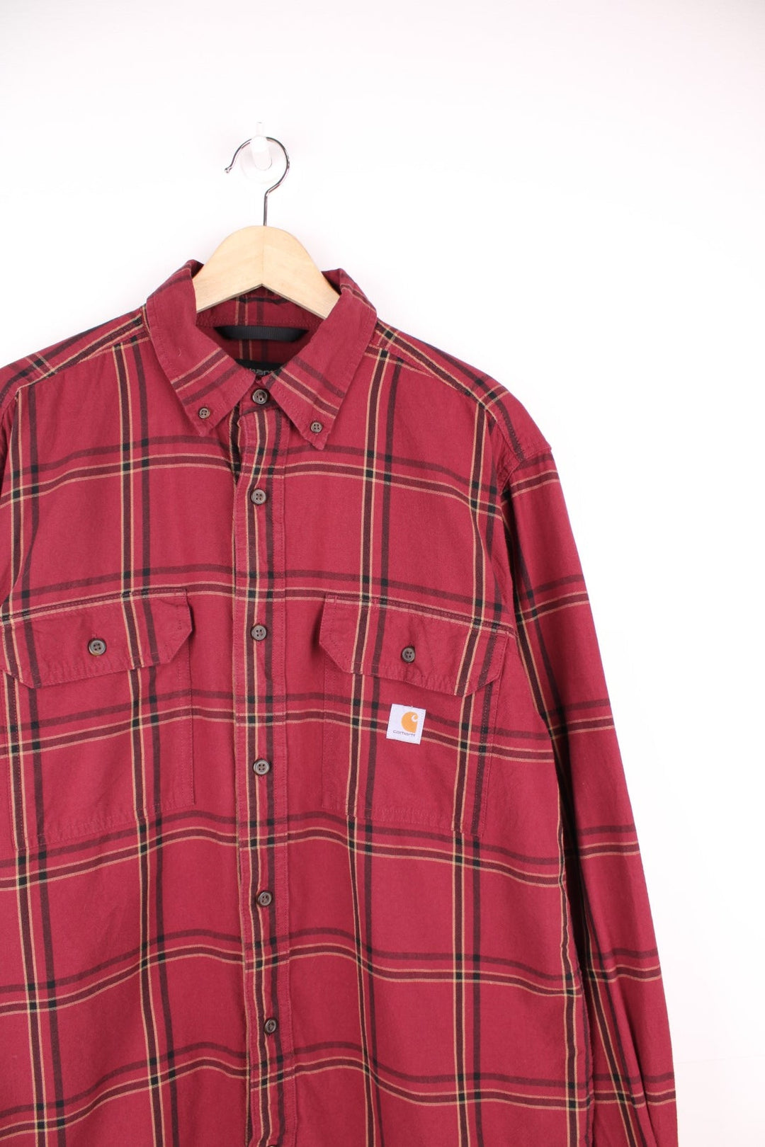 Carhartt red and beige button through plaid long sleeved shirt. Features chest pockets and embroidered logo. 