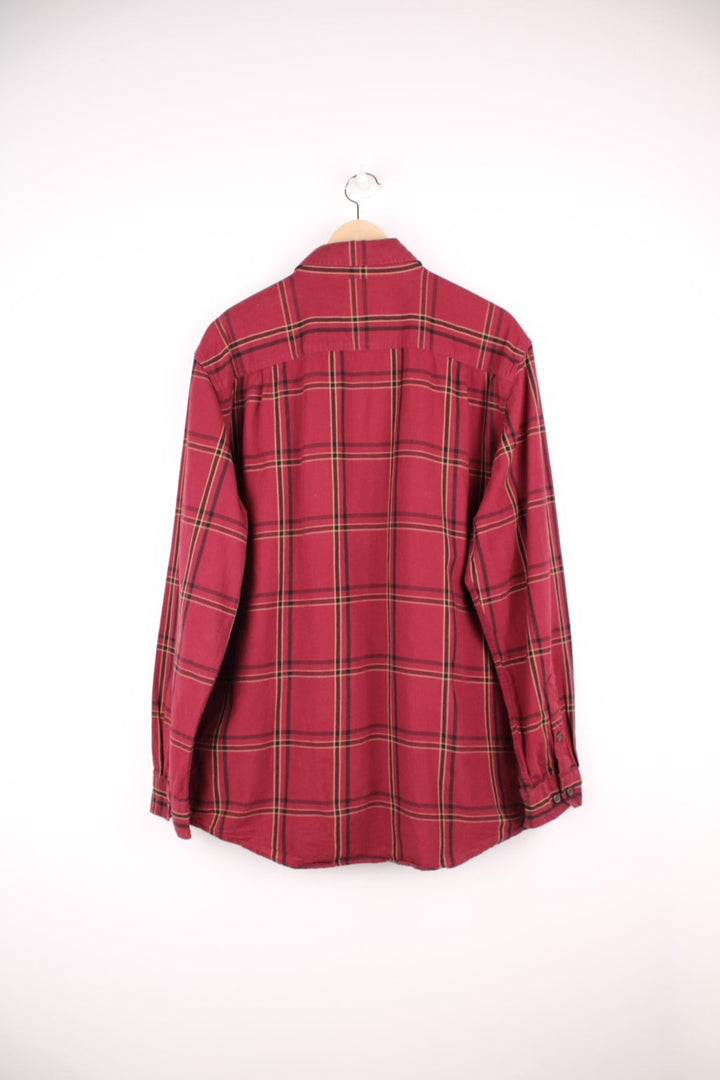 Carhartt red and beige button through plaid long sleeved shirt. Features chest pockets and embroidered logo. 