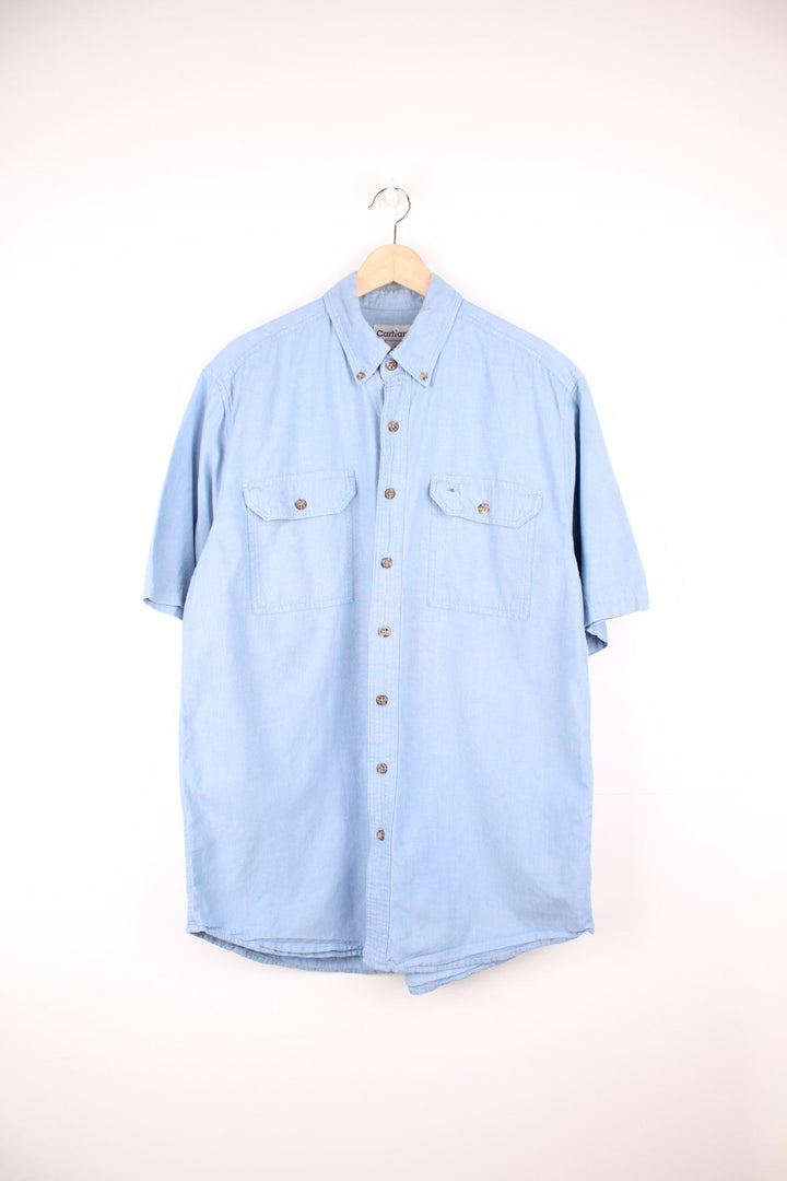 Carhartt blue button through shirt featuring chest pockets and C logo.