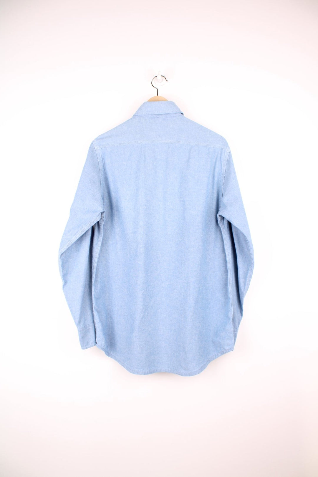 Carhartt blue button through long sleeved shirt with chest pockets and embroidered logo. 