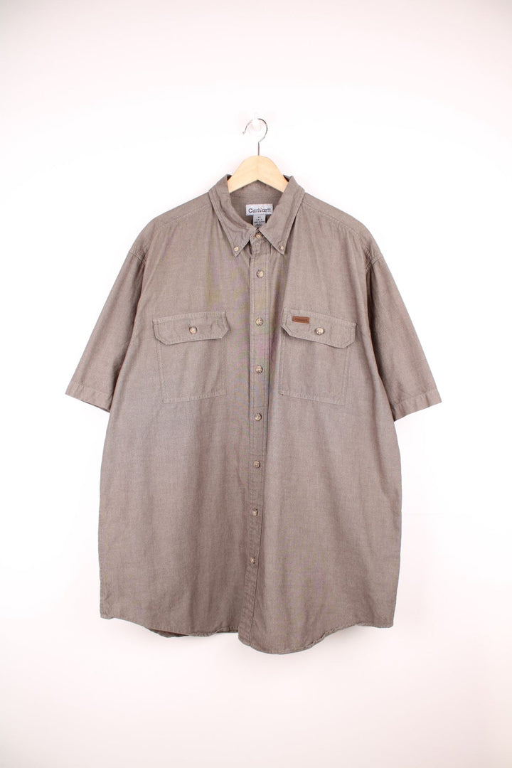 Carhartt khaki green button through shirt with chest pockets and embroidered leather logo.