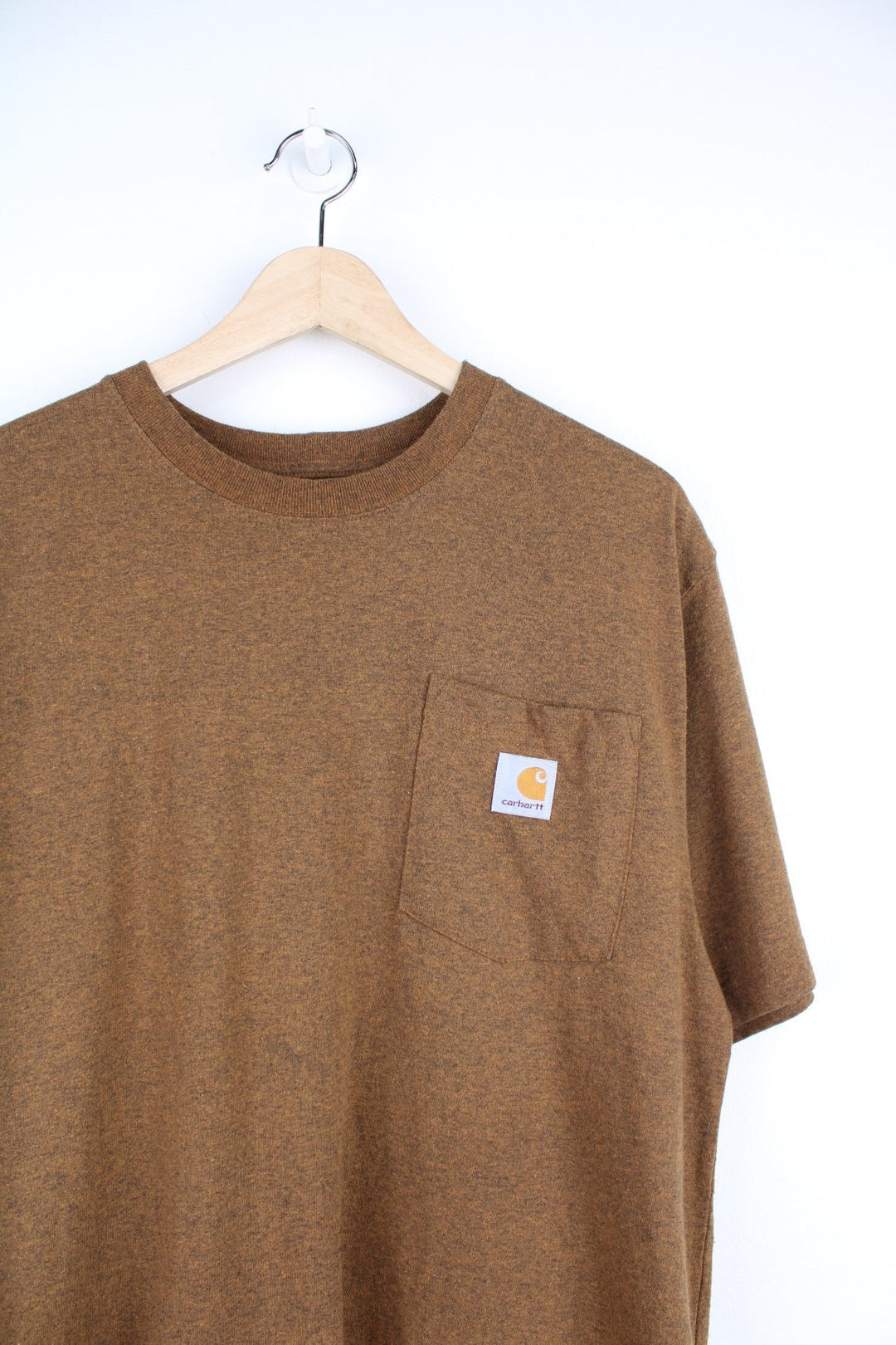 Carhartt T-Shirt in a brown colourway, has a chest pocket with the logo embroidered on it. 