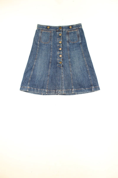 Chloe blue denim A-line midi skirt with button closure, patch pockets on the front and zip pockets on the back. 