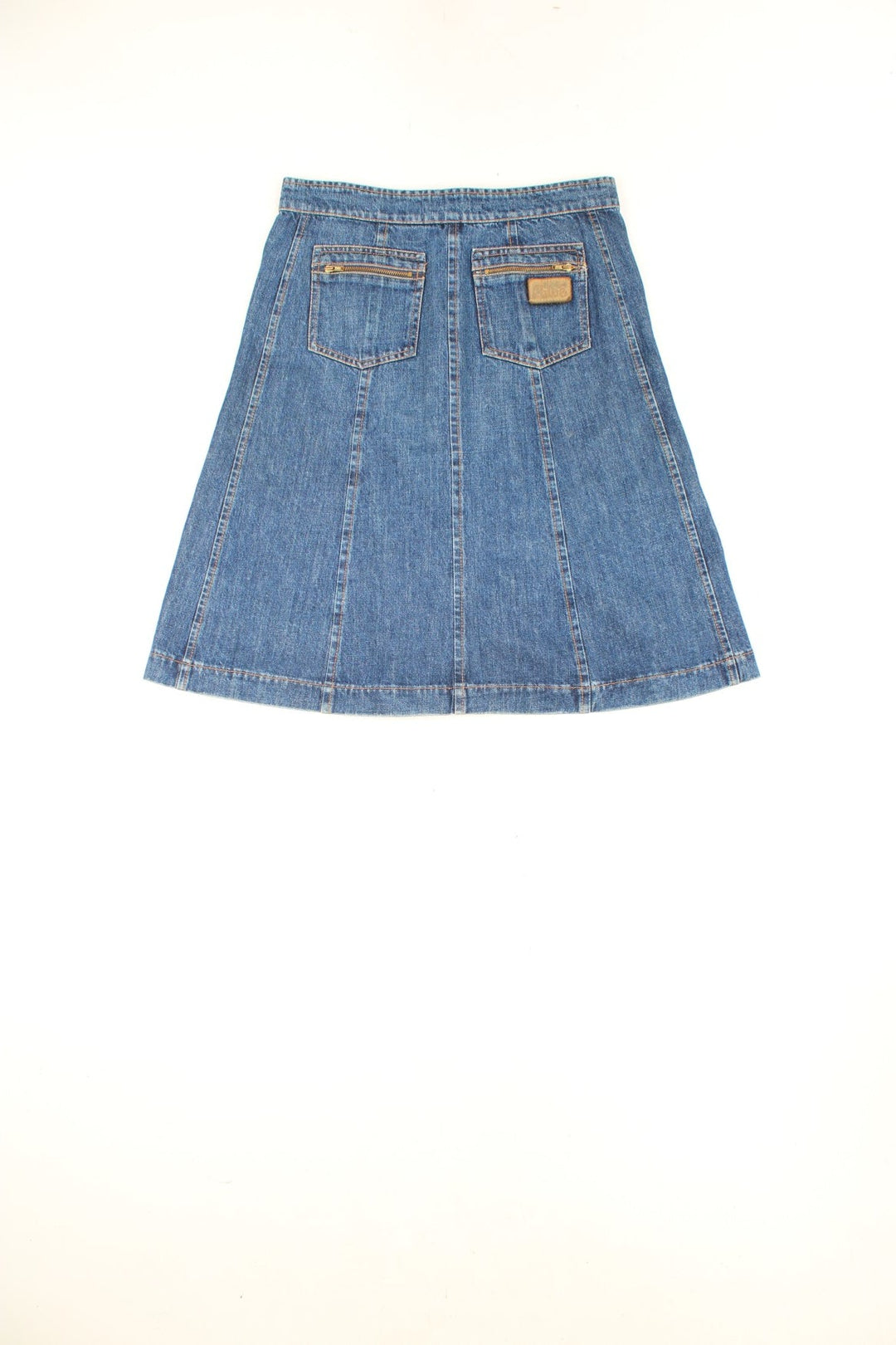 Chloe blue denim A-line midi skirt with button closure, patch pockets on the front and zip pockets on the back. 