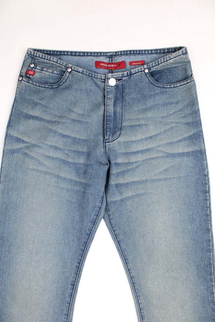 Miss Sixty 'Augusta' mid rise flared jeans in a faded light wash with two front pockets and a small red '60' tag. 