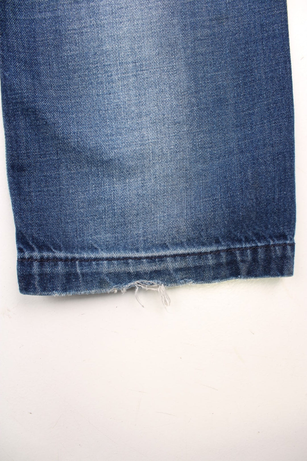 Miss Sixty 'Barbuda' straight leg jeans in a faded blue wash with four pockets, a branded tab on the reverse, and large circular snaps on the front pockets. 