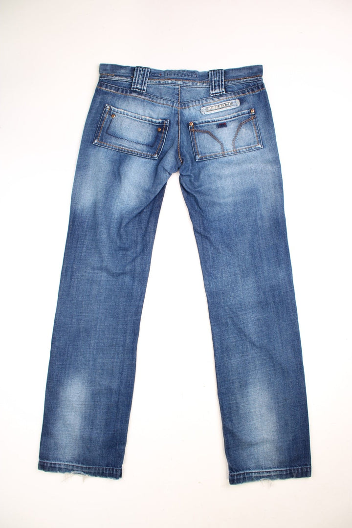 Miss Sixty 'Barbuda' straight leg jeans in a faded blue wash with four pockets, a branded tab on the reverse, and large circular snaps on the front pockets. 