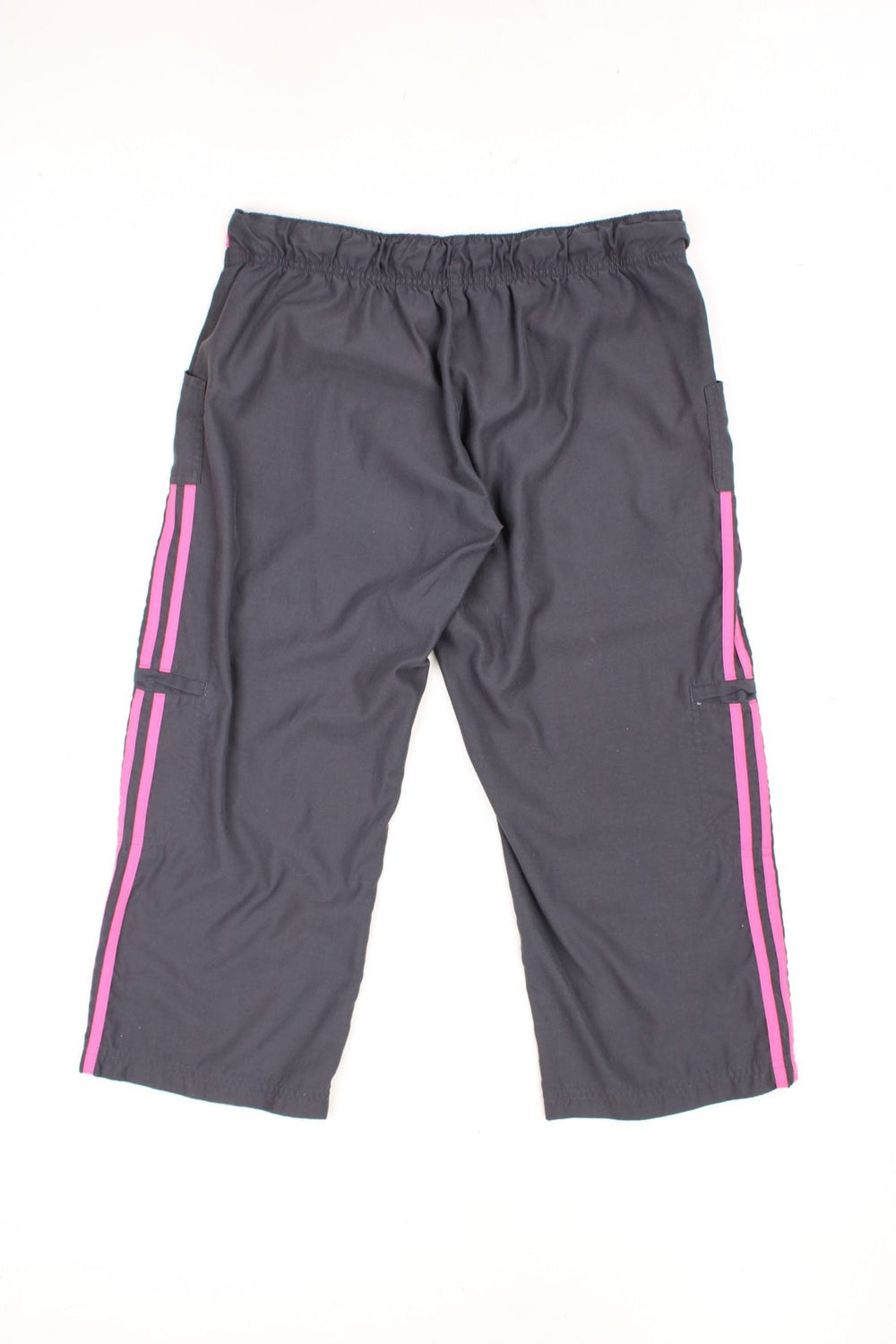 Grey and pink Adidas 3/4 length tracksuit bottoms with embroidered logo, signature three stripes down the leg and tie waist. 