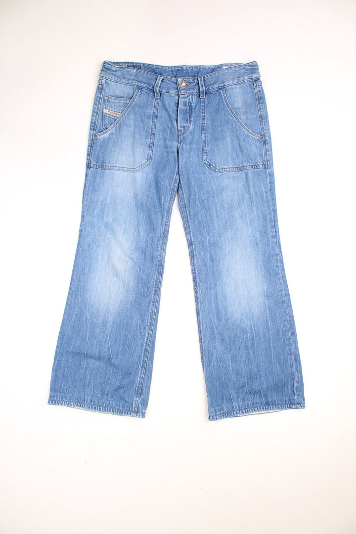 Diesel Industries low rise straight leg jeans with carpenter style pockets and a branded back patch.