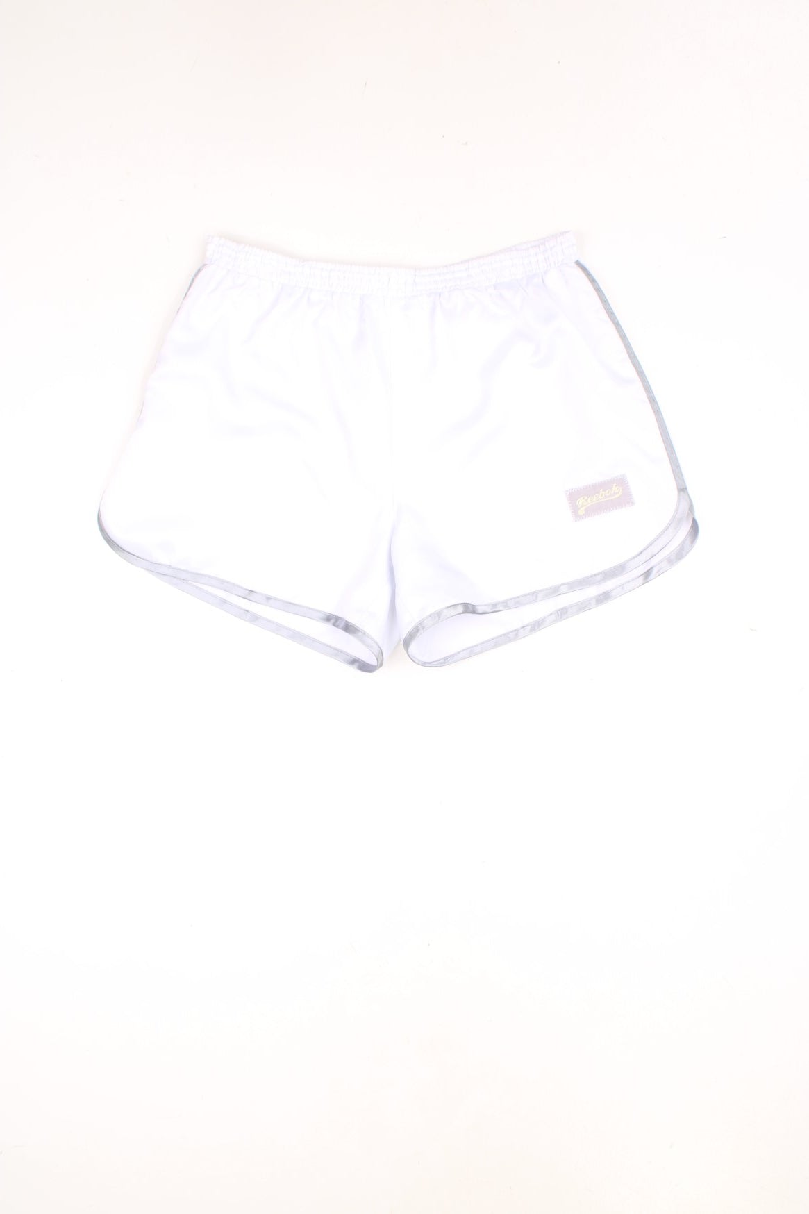 Vintage Reebok dance shorts with elasticated drawstring waist. Features embroidered logo and silver detailing. 