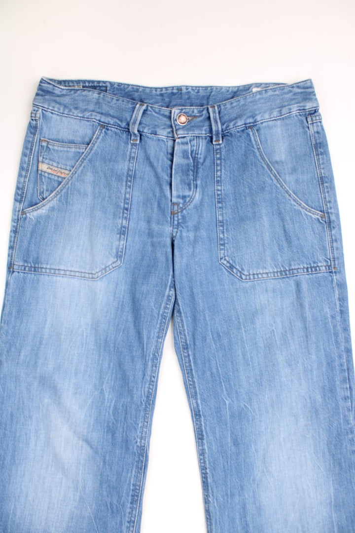 Diesel Industries low rise straight leg jeans with carpenter style pockets and a branded back patch.