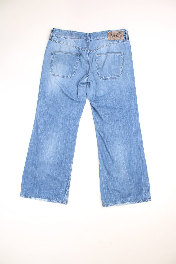 Diesel Industries low rise straight leg jeans with carpenter style pockets and a branded back patch.