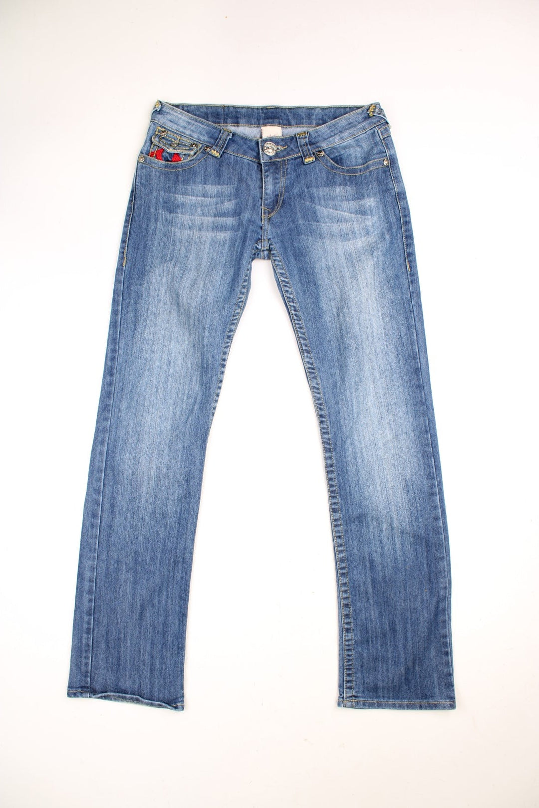 True Religion low rise straight leg jeans in a faded blue wash. Signature horseshoe embroidery in red on back pockets.  