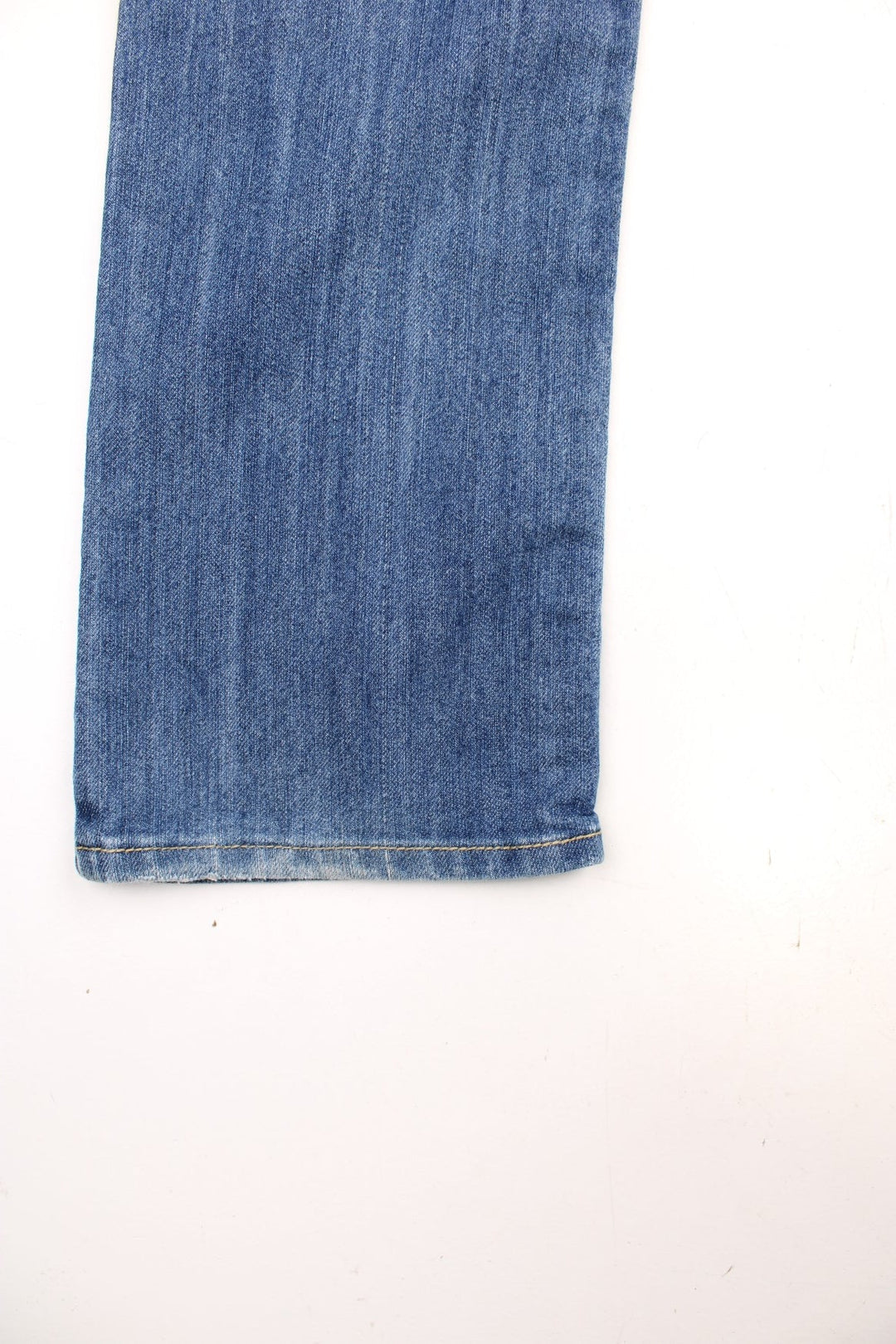 True Religion low rise straight leg jeans in a faded blue wash. Signature horseshoe embroidery in red on back pockets.  