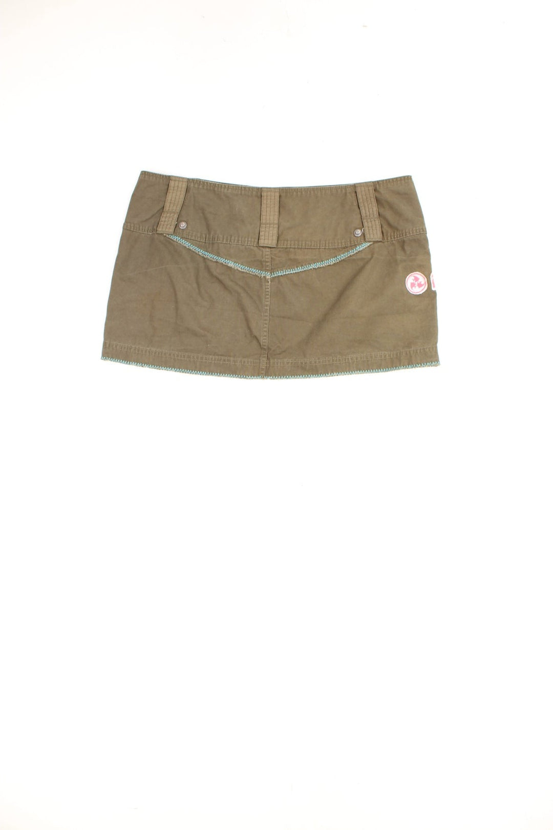 Vintage Diesel low rise cargo style mini skirt in khaki green. Features graphic badge patches, button fastening and pocket.