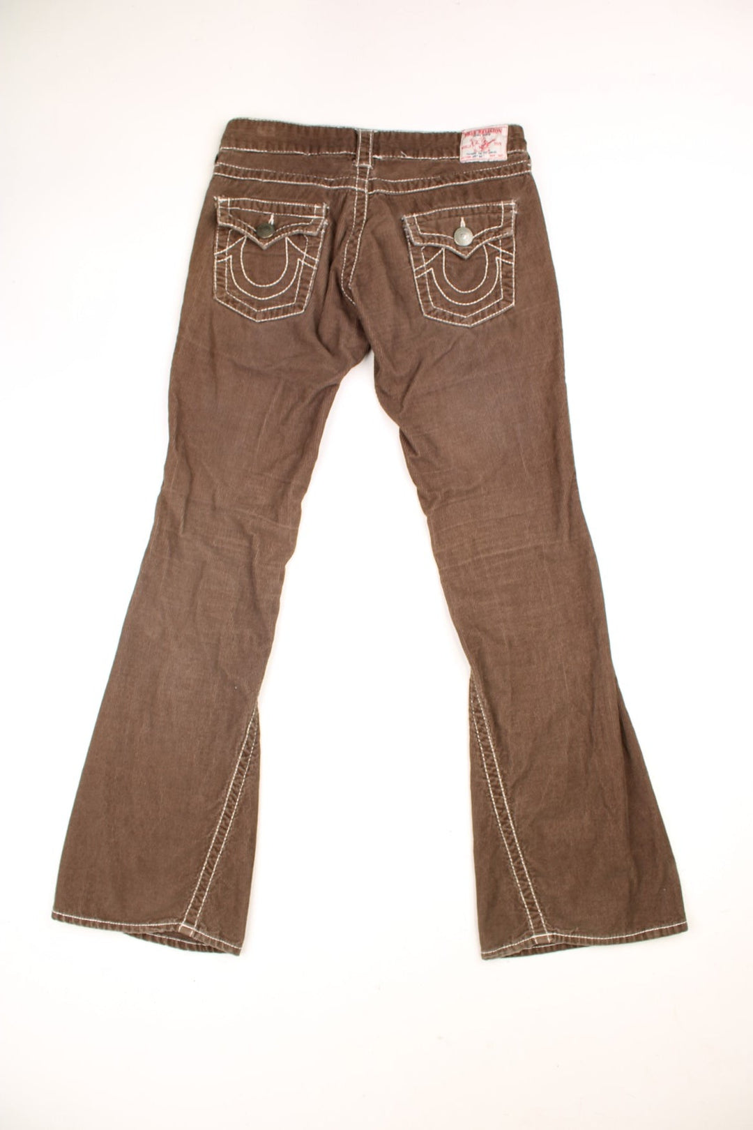 Y2K True Religion Corduroy Trousers in a brown colourway with cross stitiching throughout, multiple pockets, and the logo embroidered on the back. 