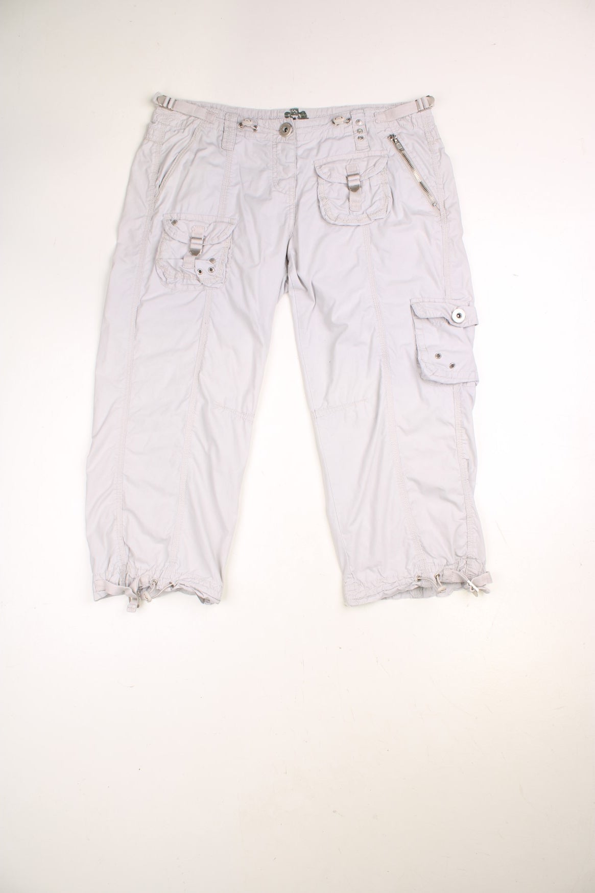 River Island Y2K Quarter Length Cargo Shorts in a light grey colourway, has multiple pockets and adjustable cuffs. 