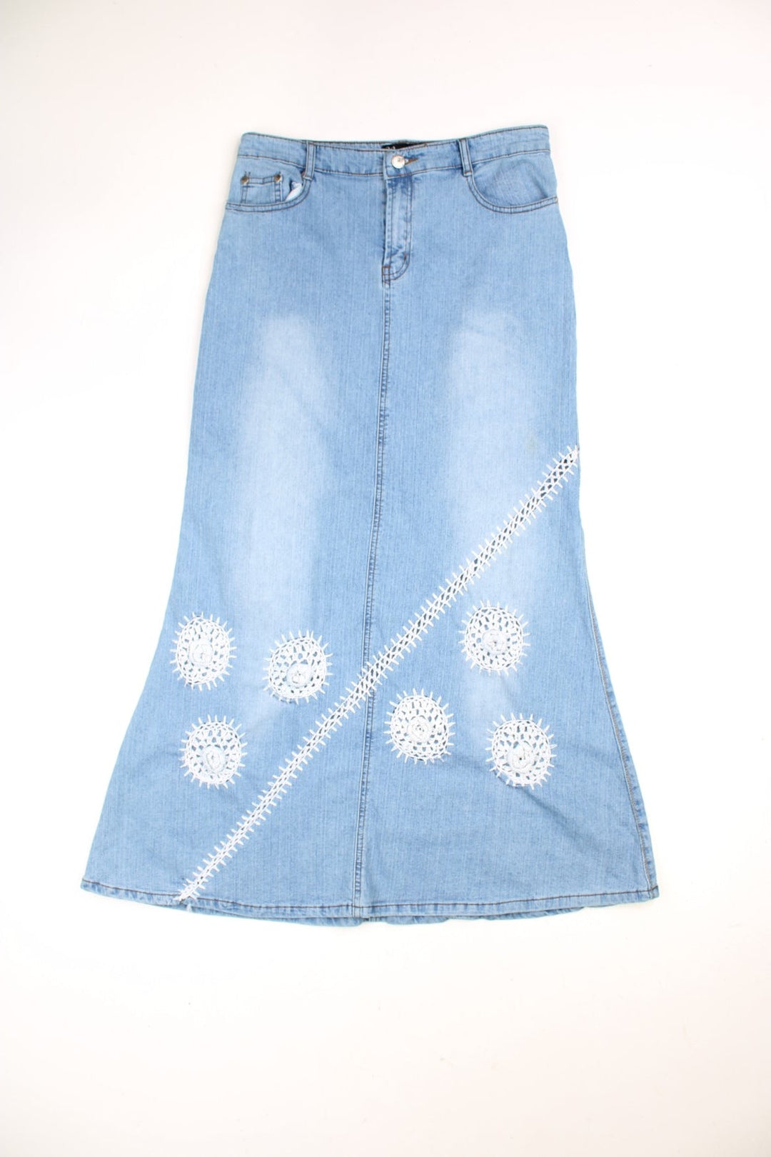 Denim Maxi Skirts in a light blue colourway with embroidered patterns on the front. 