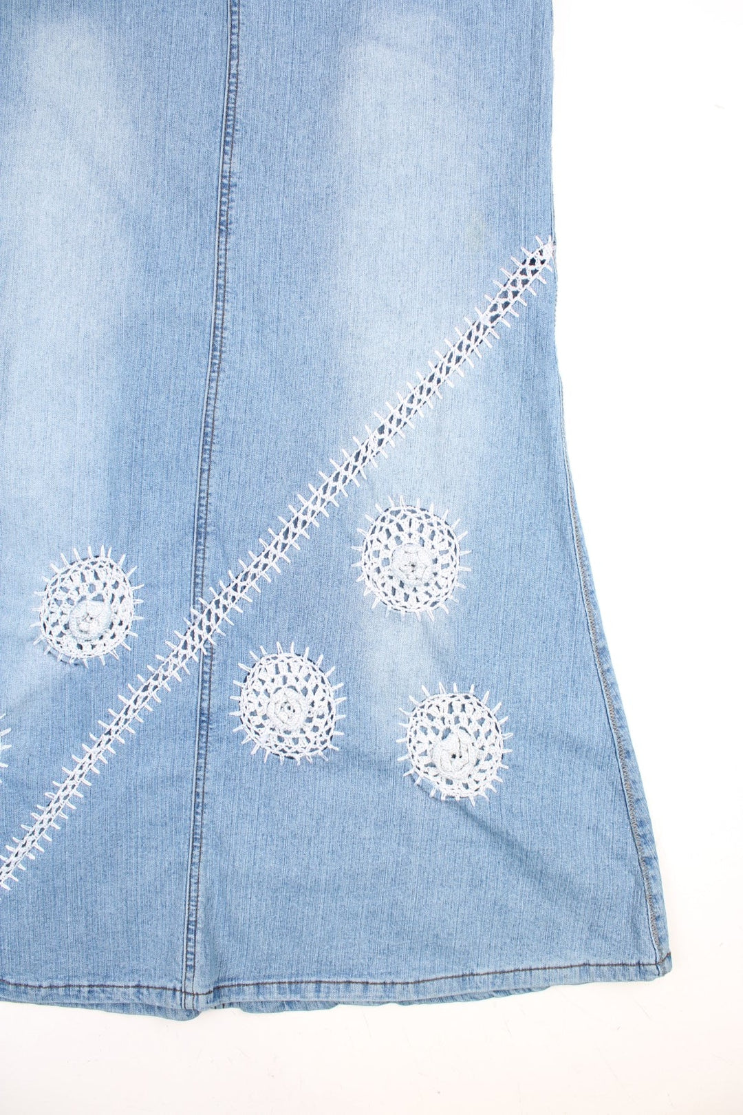 Denim Maxi Skirts in a light blue colourway with embroidered patterns on the front. 