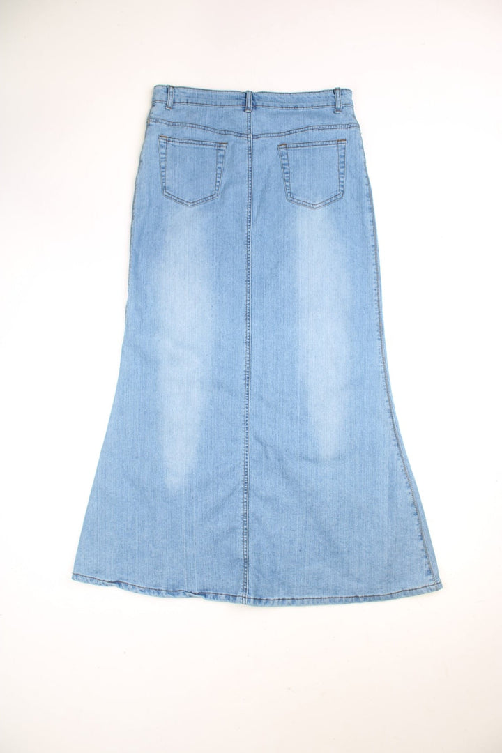 Denim Maxi Skirts in a light blue colourway with embroidered patterns on the front. 