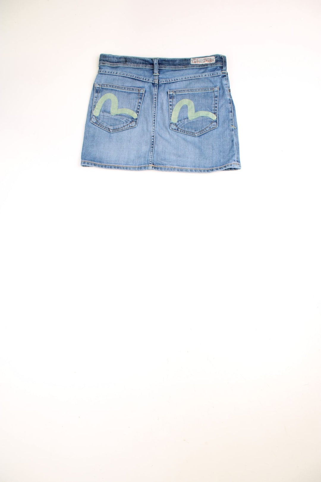 Y2K Evisu x Puma Mini Skirt in a light blue colourway with the logo printed on the back pockets.