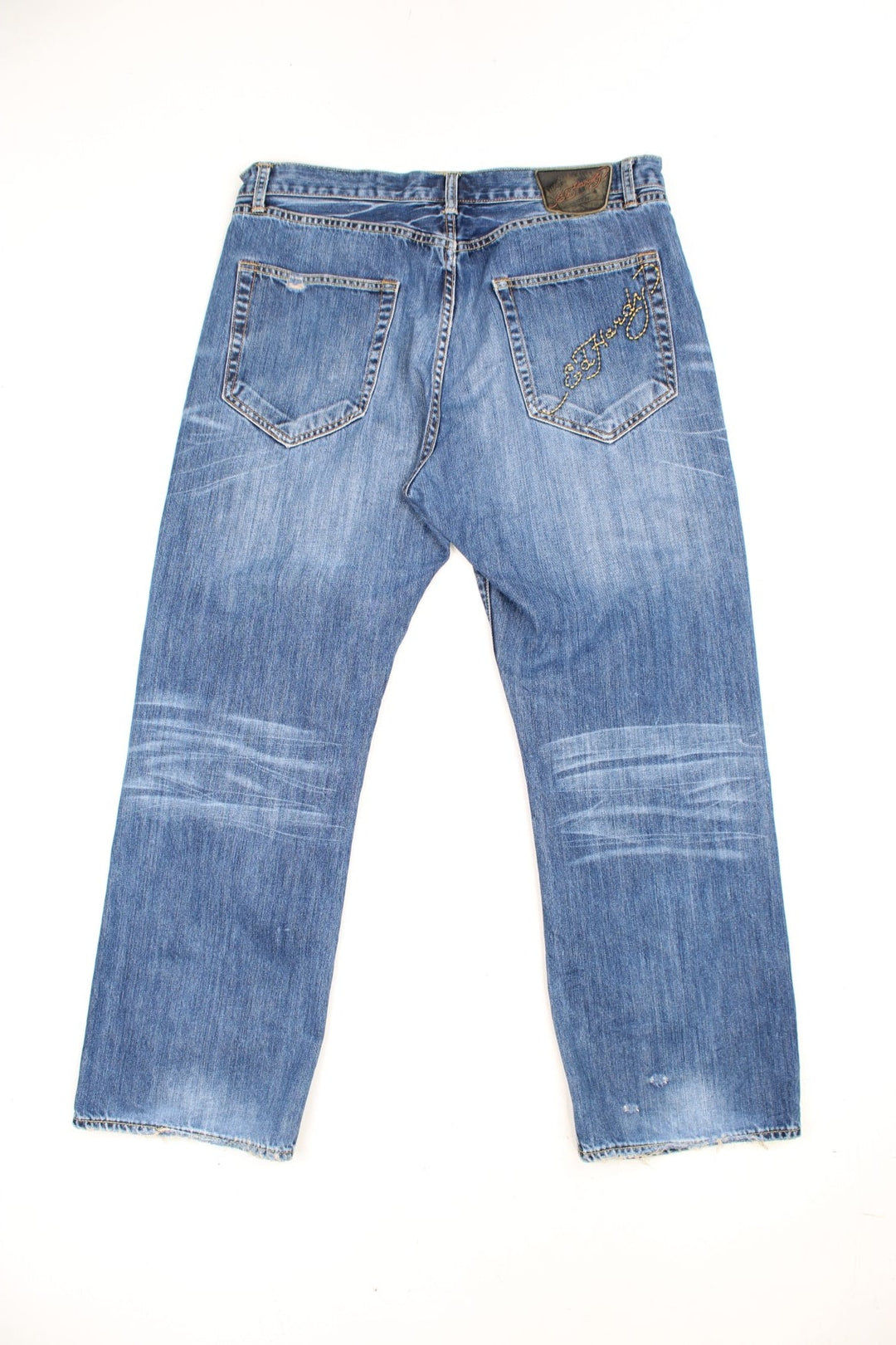 Vintage Y2K Ed Hardy faded effect blue denim Jeans with embroidered spell out logo on the back pocket.  